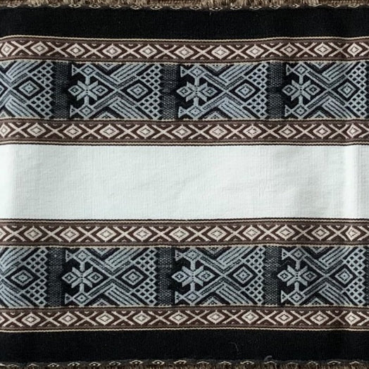 Textile with intricate patterns and colors on a black background