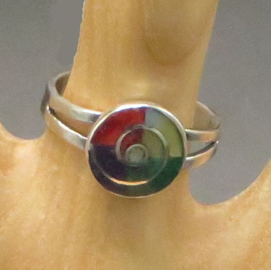 Multi colored stone inlay in round face with silver spiral design and silver band 