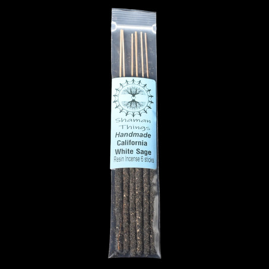 Packaged white sage resin incense sticks with a label on a black background