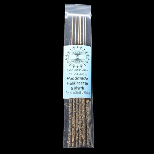 Pack of handmade frankincense and myrrh resin incense sticks with a label on a black background