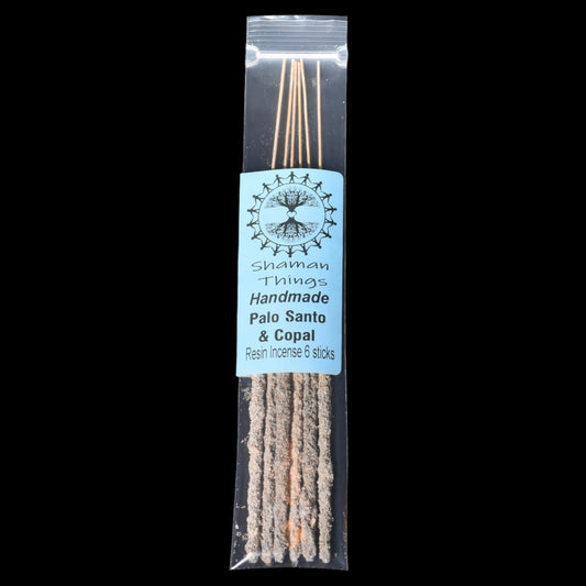 Packaged Palo Santo and Copal resin incense sticks with a label on a black background