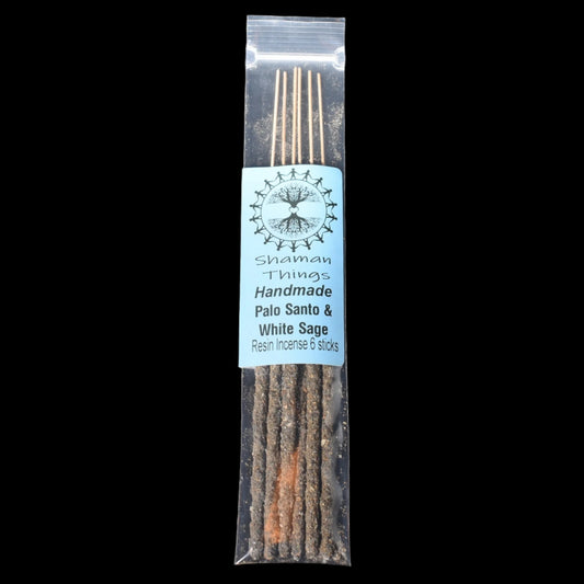 Packaged Palo Santo and Sage incense sticks with a label on a black background