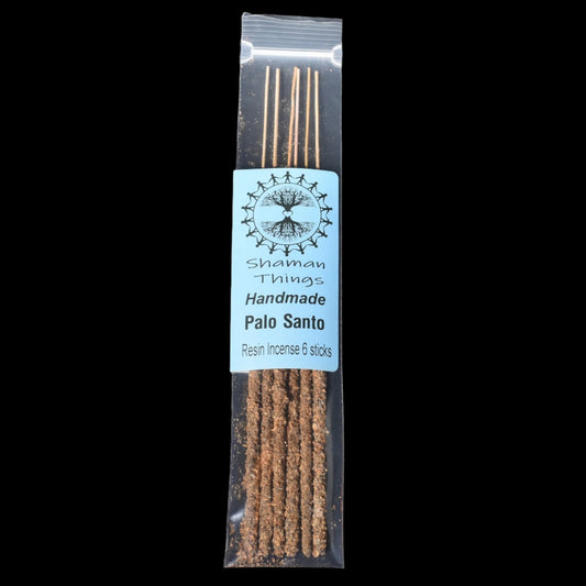 Pack of Palo Santo resin incense sticks with a label on a black background